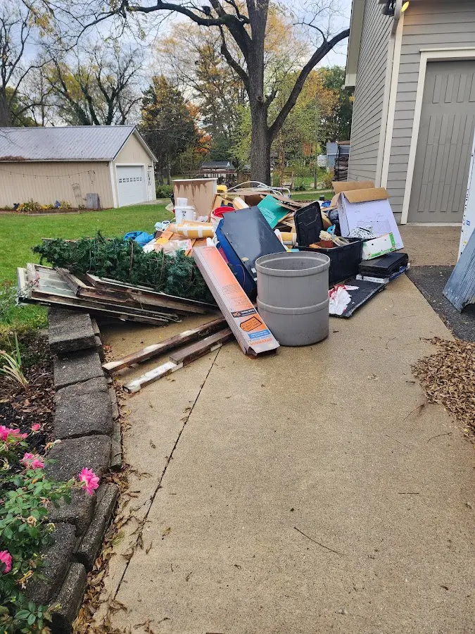 Dumpster being loaded with debris for 3 Yard Dumpster Rental in Buena Vista